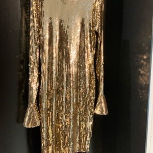 Party dress in gold sequins.